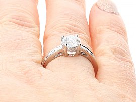 Diamond Solitaire with Diamond Shoulders Being Worn