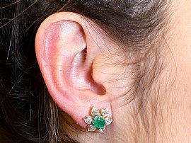 Emerald and Diamond Flower Earrings Wearing Image