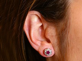 Vintage Ruby and Diamond Cluster Earrings Being Worn