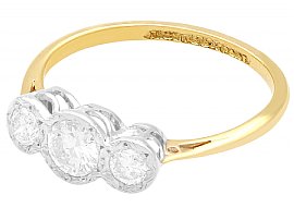 A Wedding Ring in Gold with Three Diamonds