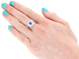 White Gold Sapphire and Diamond Cluster Ring Being Worn
