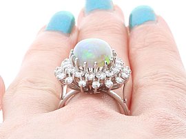 Close up Image of Opal and Diamond Dress Ring Being Worn
