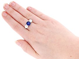Sapphire and Diamond Trilogy Engagement Ring Wearing Image