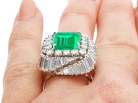 Large Emerald and Diamond Ring on the Finger
