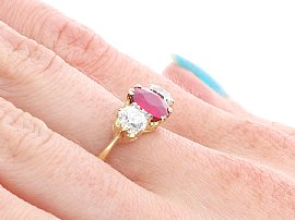 Ruby Trilogy Ring on the Hand