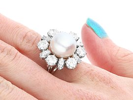 Diamond and Pearl Ring on the Hand
