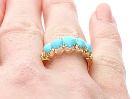 turquoise stone gold ring on hand