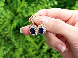 Blue Sapphire Dangle Earrings in Gold Outside