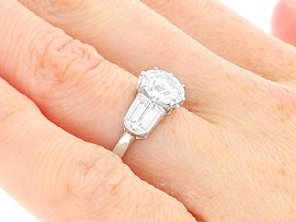 Solitaire Diamond Ring with Baguettes on Hand