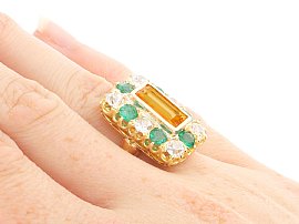 Topaz and Emerald Ring on the Hand