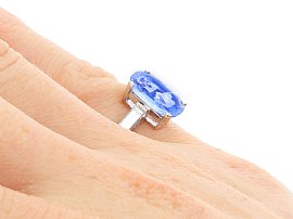 On hand Cushion Cut Sapphire Ring with Baguette Side Stones
