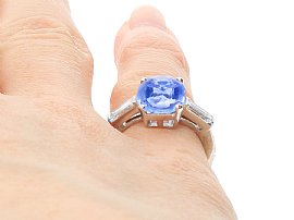 Close up Cushion Cut Sapphire Ring with Baguette Side Stones