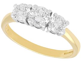 Round Cut Three Stone Engagement Ring in Yellow Gold