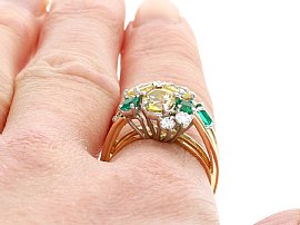 Emerald and Yellow Sapphire Ring Being Worn