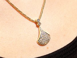 Close up Yellow Gold Diamond Pendant Necklace