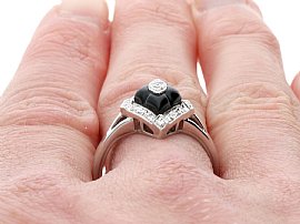 Diamond and onyx ring being worn