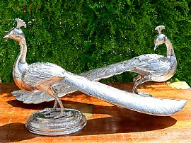 Pair of Large Silver Bird Ornaments Outside