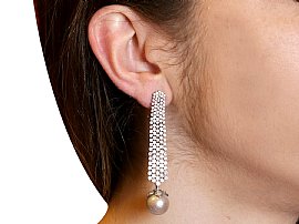 Wearing Multi Strand Diamond Drop Earrings with Pearls