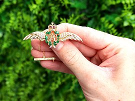Gold RAF Wings Brooch with Emeralds for Sale Outside