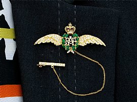 Gold RAF Wings Brooch with Emeralds for Sale Wearing
