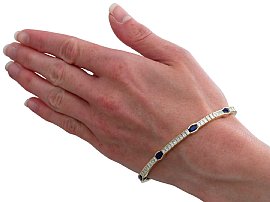 wearing sapphire and diamond bracelet