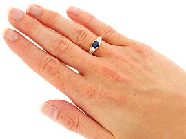 wearing sapphire and diamond ring