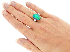 cabochon black opal and diamond ring for sale wearing