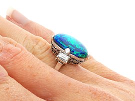 Antique cabochon black opal and diamond ring for sale wearing