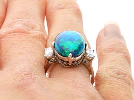 cabochon black opal and diamond ring for sale wearing