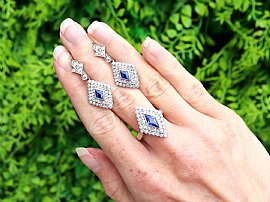 lozenge cut sapphire earrings with diamonds outside