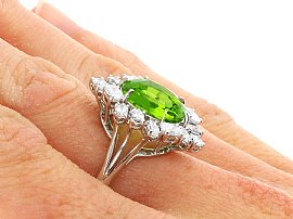 Oval Peridot Engagement Ring with Diamonds worn on hand