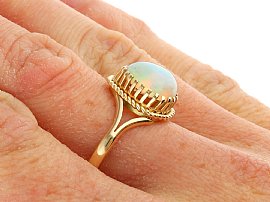 Cabochon Opal Ring in Yellow Gold for Sale Wearing