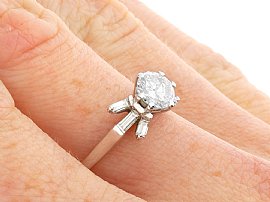 Round Solitaire with Baguettes in White Gold Being Worn