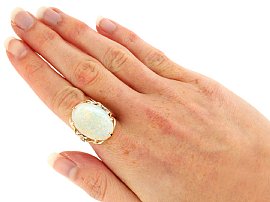 Large White Opal Ring in Yellow Gold Wearing