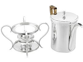 Silver Coffee Pot Beside Spirit Burner and Stand
