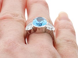 wearing aquamarine ring with half moon diamonds