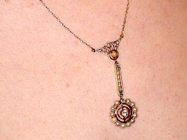antique pearl pendant on the neck 