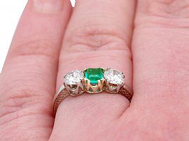Emerald and Diamond Three Stone Ring Wearing Finger