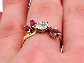 close up on finger of ruby and diamond ring