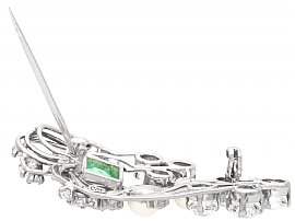 white gold emerald brooch with diamonds