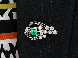 wearing a 1920s emerald brooch