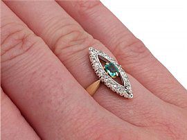 Marquise Shaped Emerald and Diamond Ring Wearing Hand