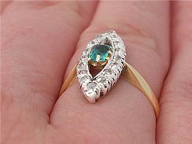 Marquise Shaped Emerald and Diamond Ring Wearing Finger