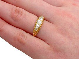 Antique five stone diamond ring on the hand